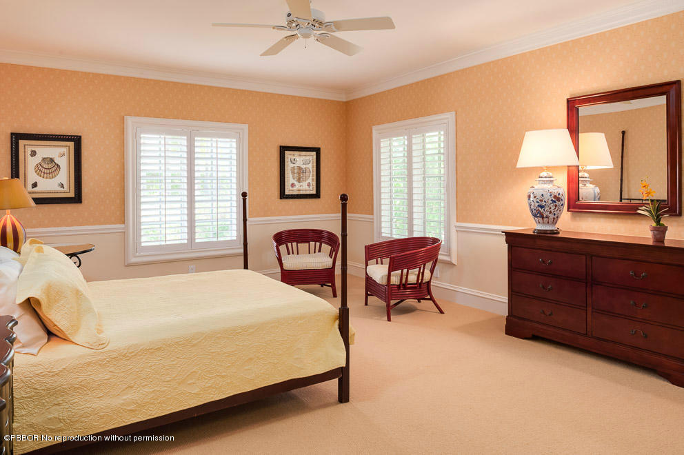 1630 Lands End Road Manalapan, FL 33462 - Photo 13 of 19 a bedroom with a bed and wooden floor