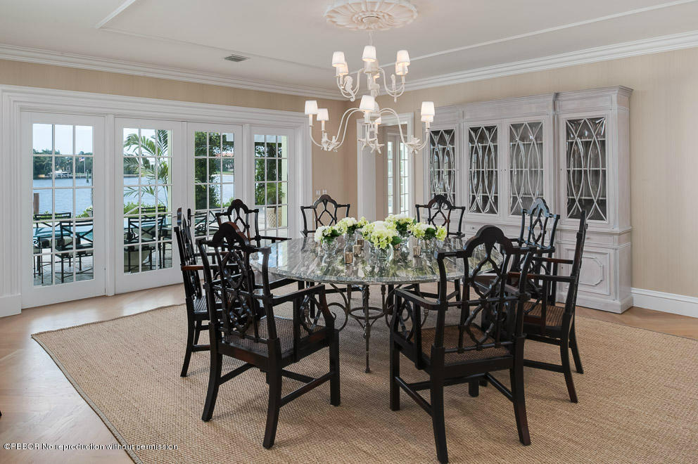1630 Lands End Road Manalapan, FL 33462 - Photo 4 of 19 a view of a dining room with furniture and wooden floor