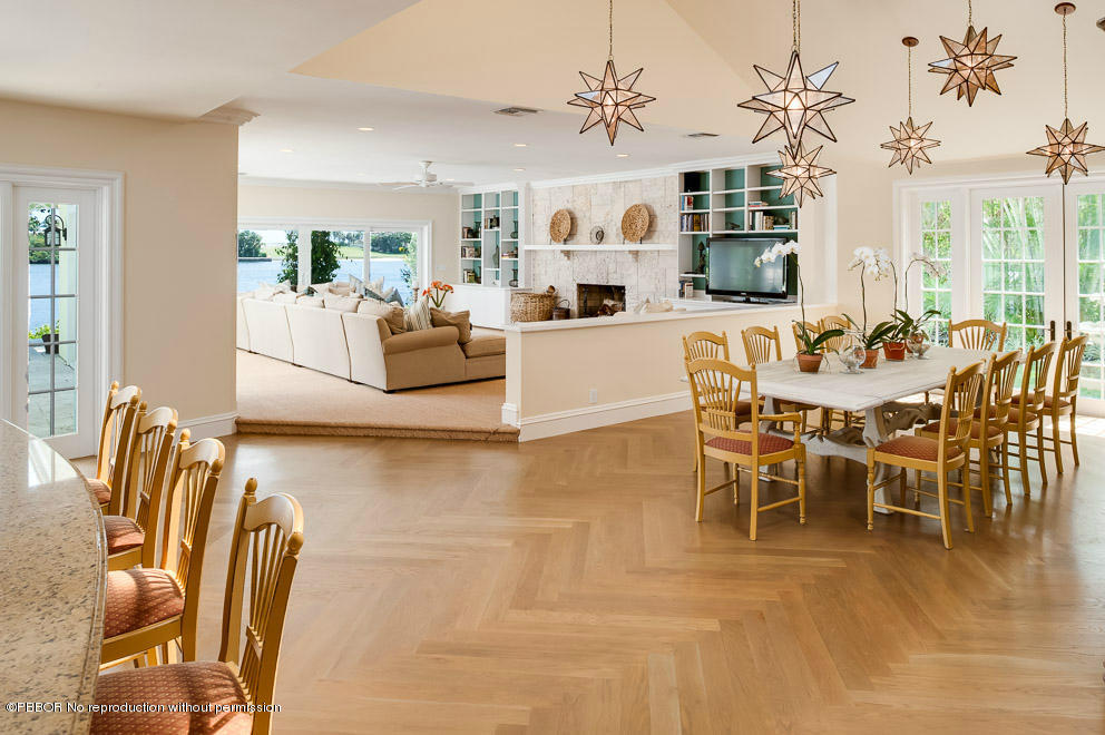 1630 Lands End Road Manalapan, FL 33462 - Photo 6 of 19 a view of a dining room with furniture and wooden floor