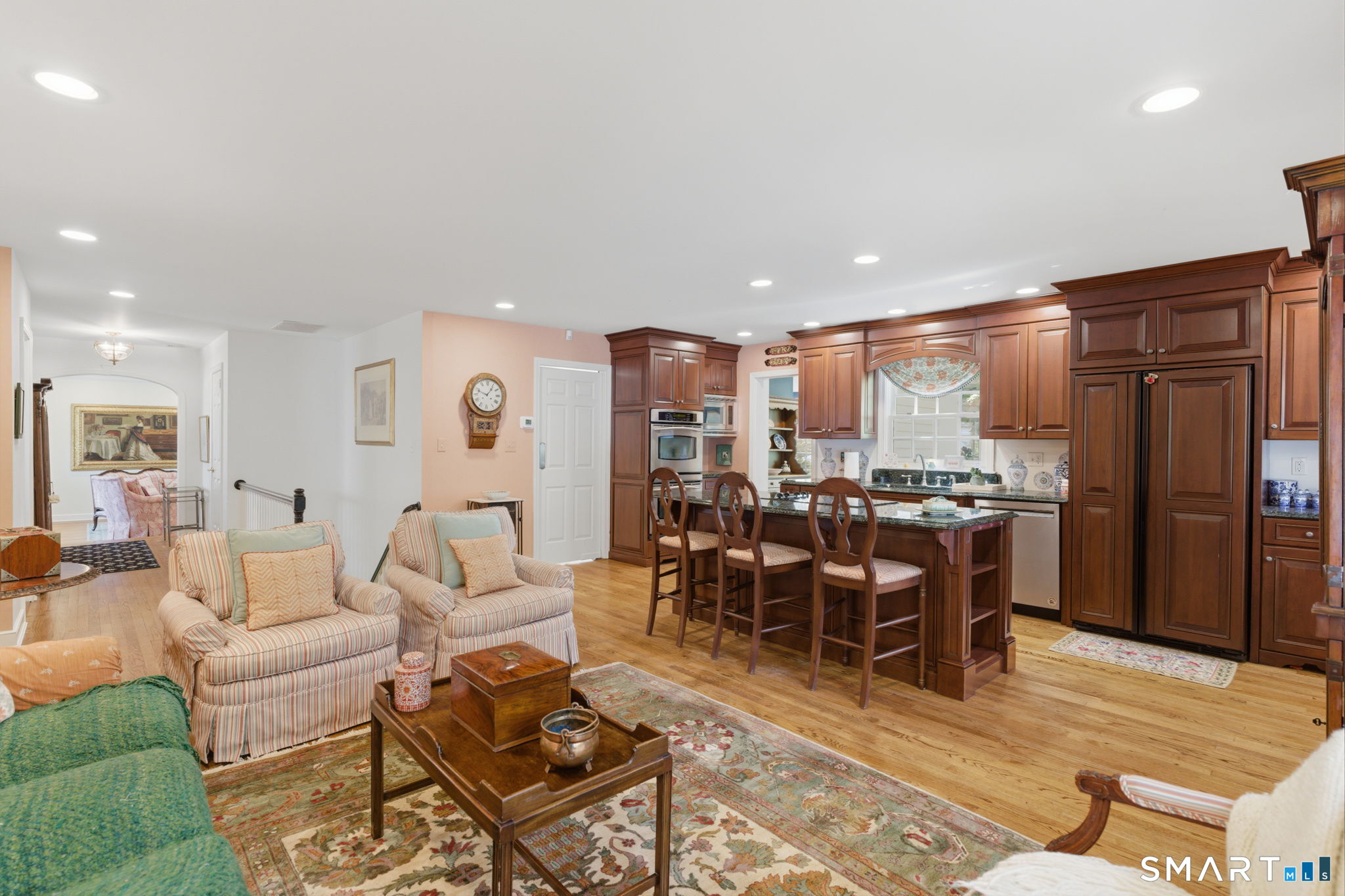 25 Norwood Road West Hartford, CT 06117 - Photo 15 of 40 a living room with lots of furniture and kitchen view