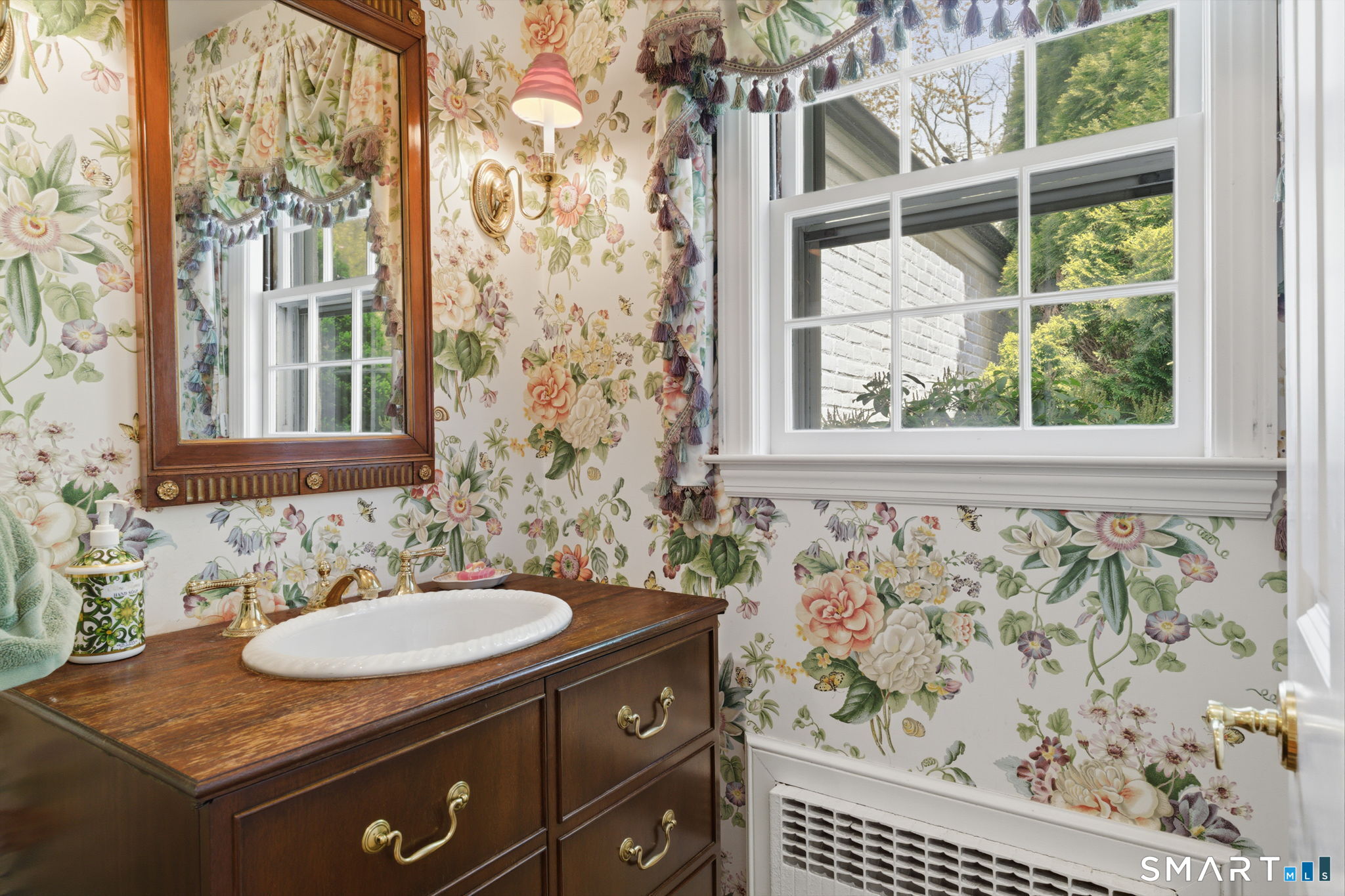 25 Norwood Road West Hartford, CT 06117 - Photo 24 of 40 a bathroom with a sink and a mirror