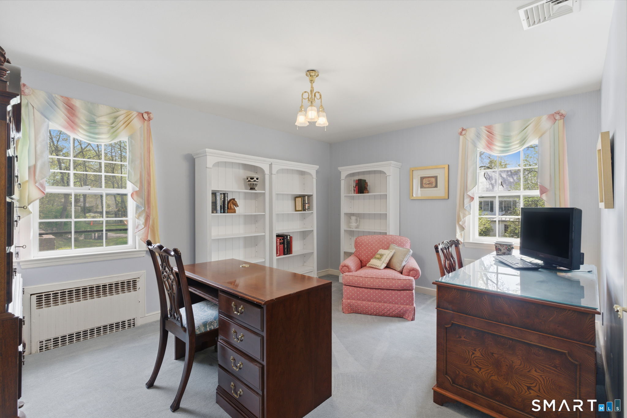 25 Norwood Road West Hartford, CT 06117 - Photo 28 of 40 a view of a workspace with furniture and a window