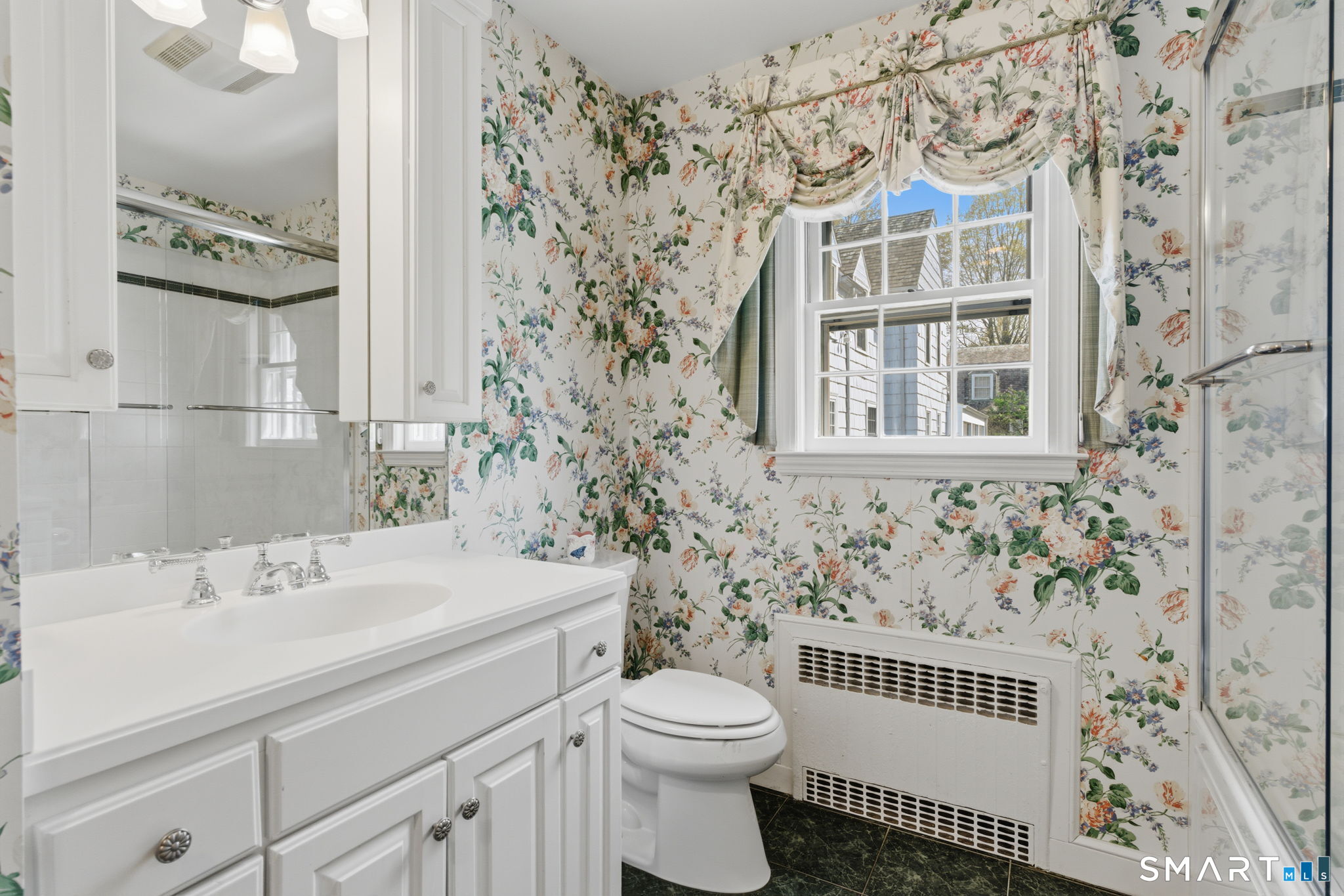 25 Norwood Road West Hartford, CT 06117 - Photo 31 of 40 a bathroom with a sink toilet and shower