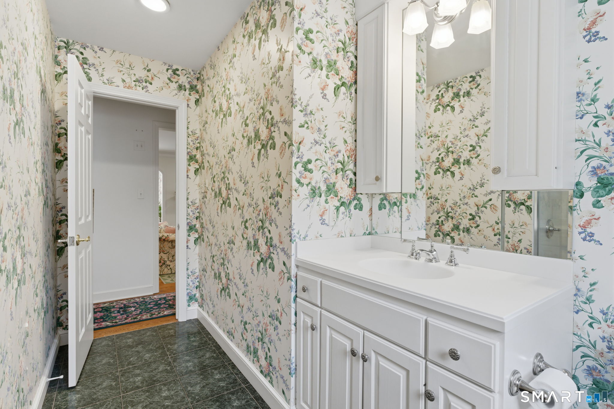25 Norwood Road West Hartford, CT 06117 - Photo 32 of 40 a bathroom with a sink and a mirror
