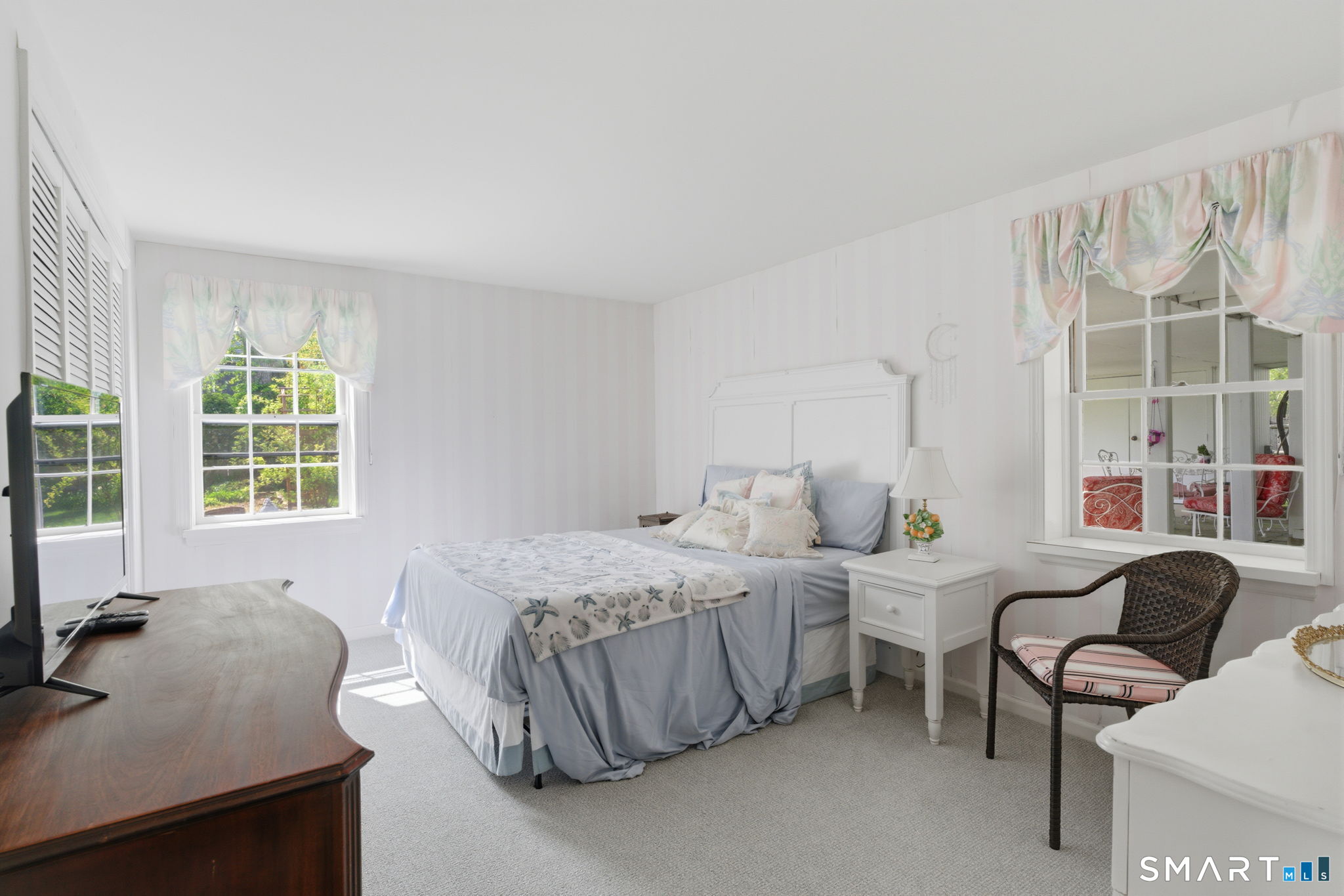 25 Norwood Road West Hartford, CT 06117 - Photo 34 of 40 a bedroom with furniture and a large window