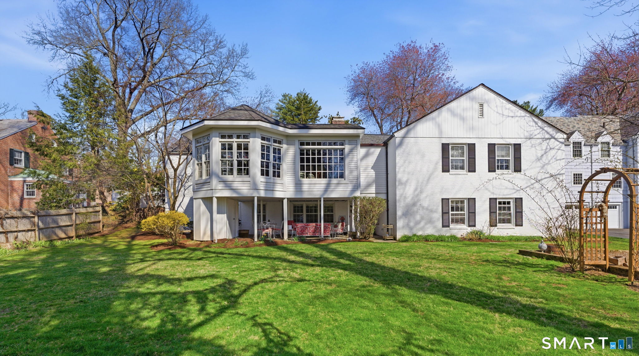 25 Norwood Road West Hartford, CT 06117 - Photo 38 of 40 a front view of a house with a yard and potted plants