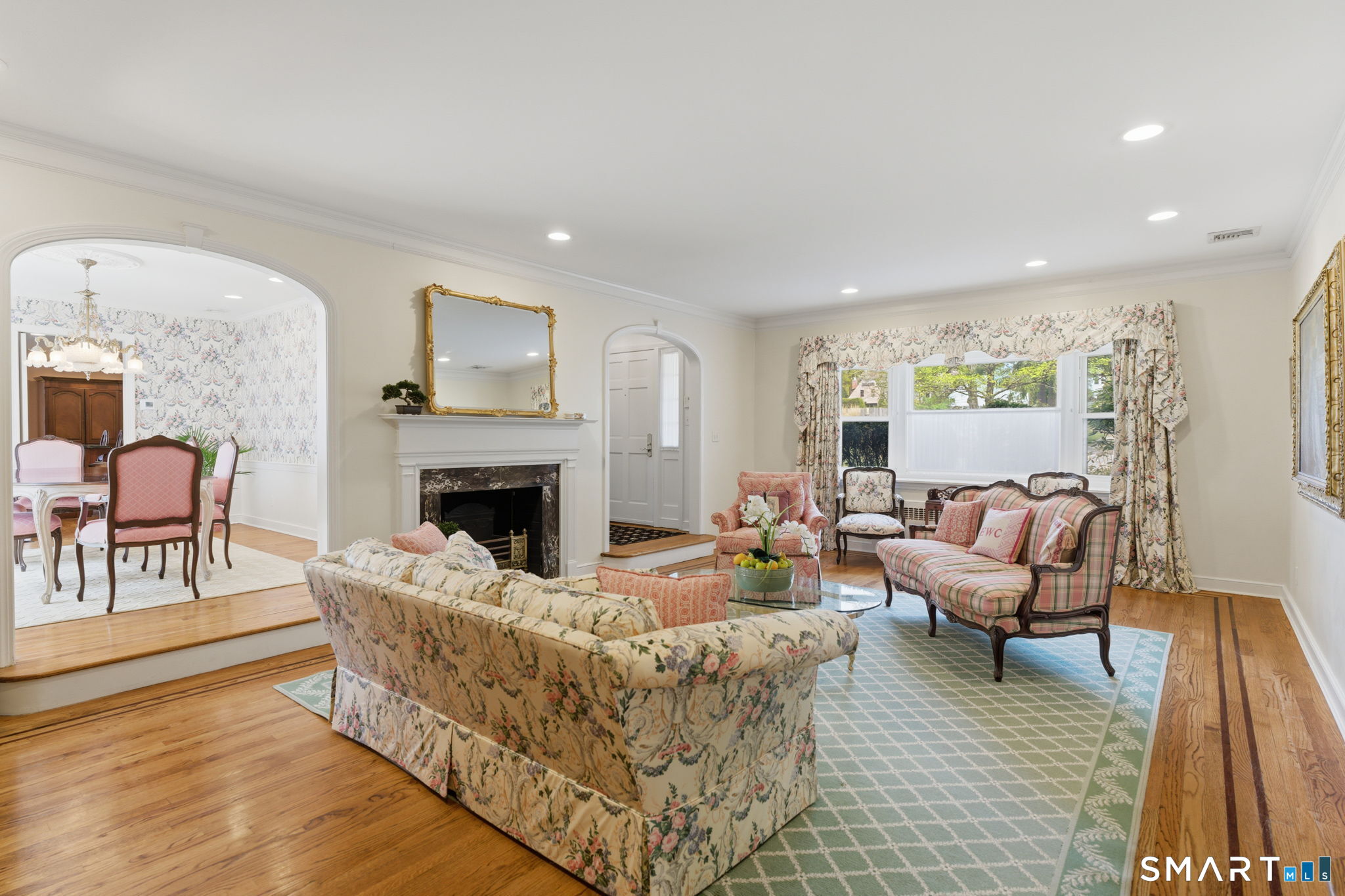25 Norwood Road West Hartford, CT 06117 - Photo 7 of 40 a living room with furniture and a fireplace
