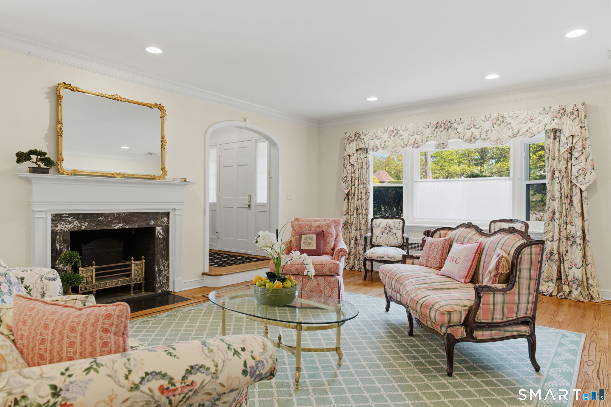 25 Norwood Road West Hartford, CT 06117 - Photo 8 of 40 a living room with furniture and a fireplace