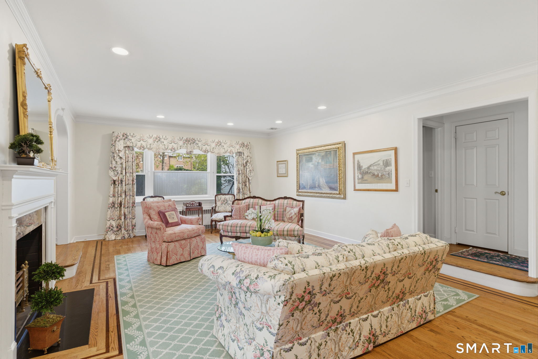 25 Norwood Road West Hartford, CT 06117 - Photo 9 of 40 a living room with fireplace furniture and a rug
