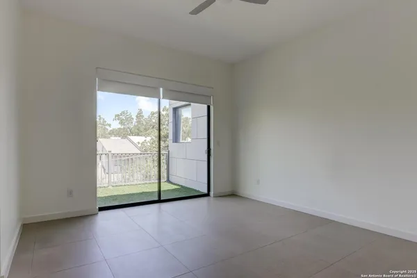 an empty room with closet and wooden floor