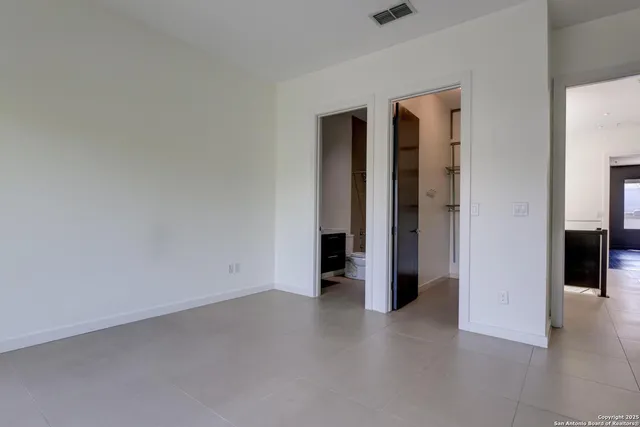 a bathroom with a sink mirror toilet and bathtub