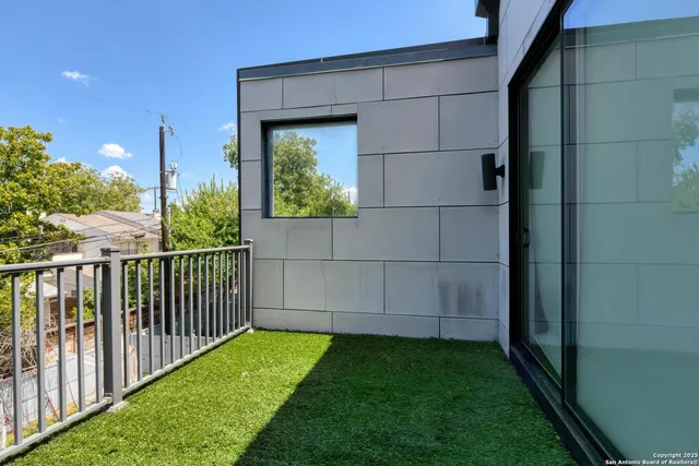 a view of a backyard with small cabin