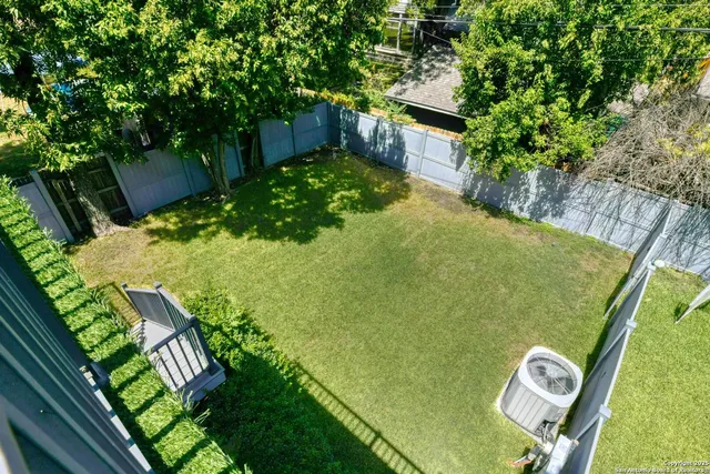 a view of balcony with wooden fence