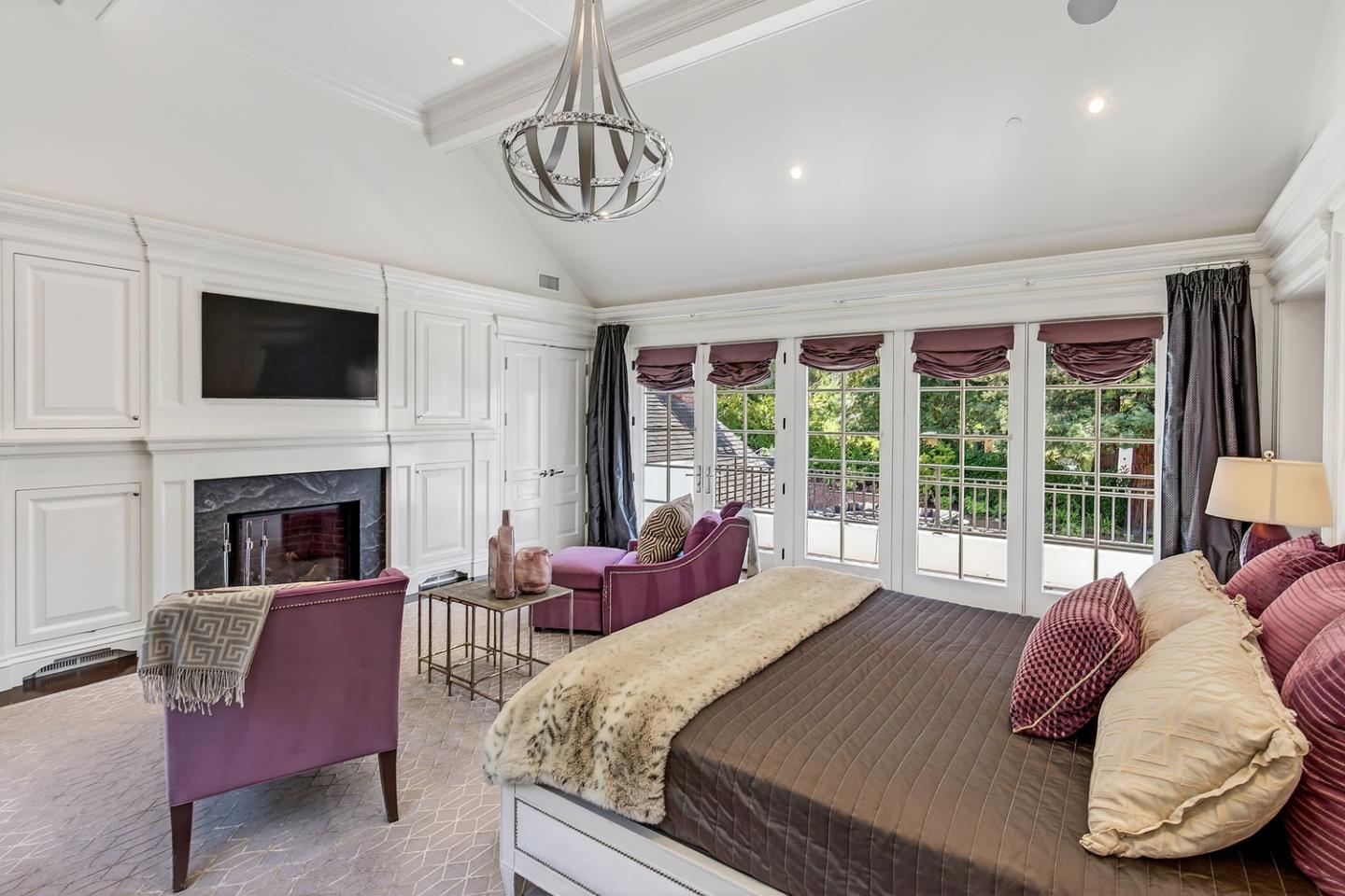 351 Walsh Road Atherton, CA 94027 - Photo 21 of 65 a spacious bedroom with a bed and a fireplace