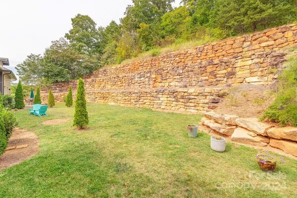 a view of yard with swimming pool