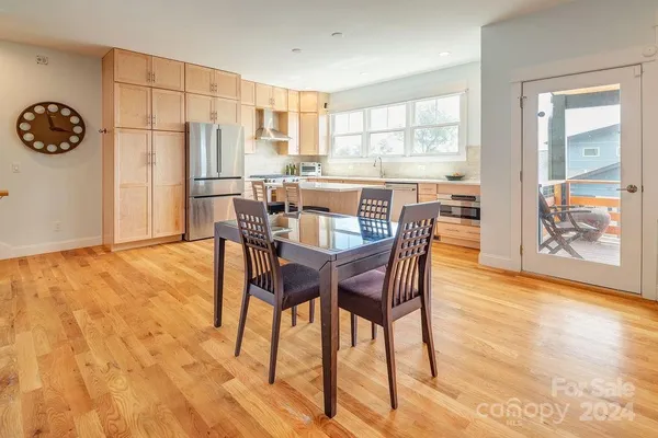 a dining room with furniture and window