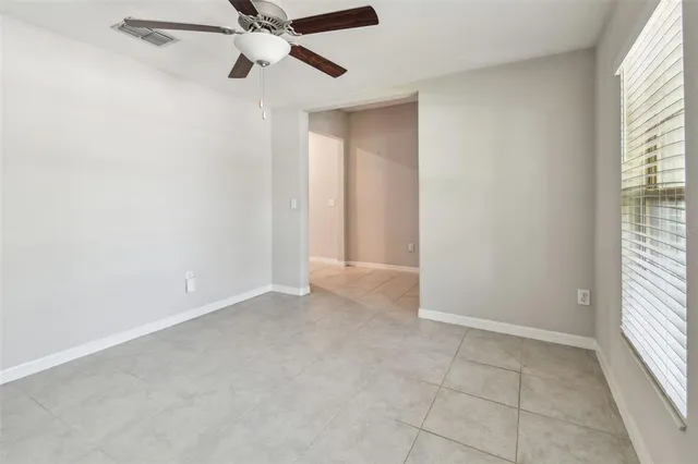 a kitchen with kitchen island granite countertop a sink a counter top space appliances and cabinets