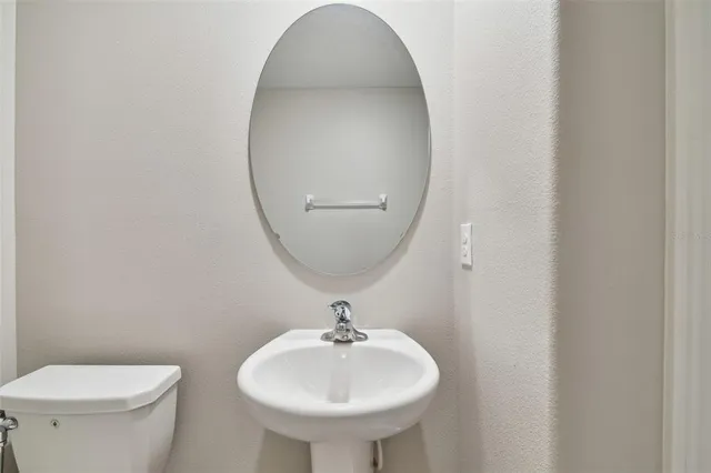 a kitchen with stainless steel appliances granite countertop a sink and a stove