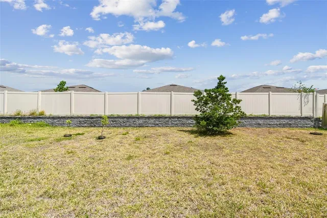 an aerial view of a house with a lake view