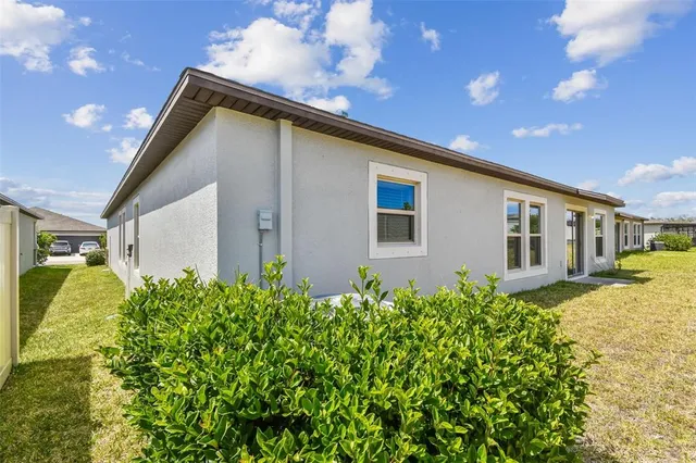 a view of a swimming pool with a table and chairs