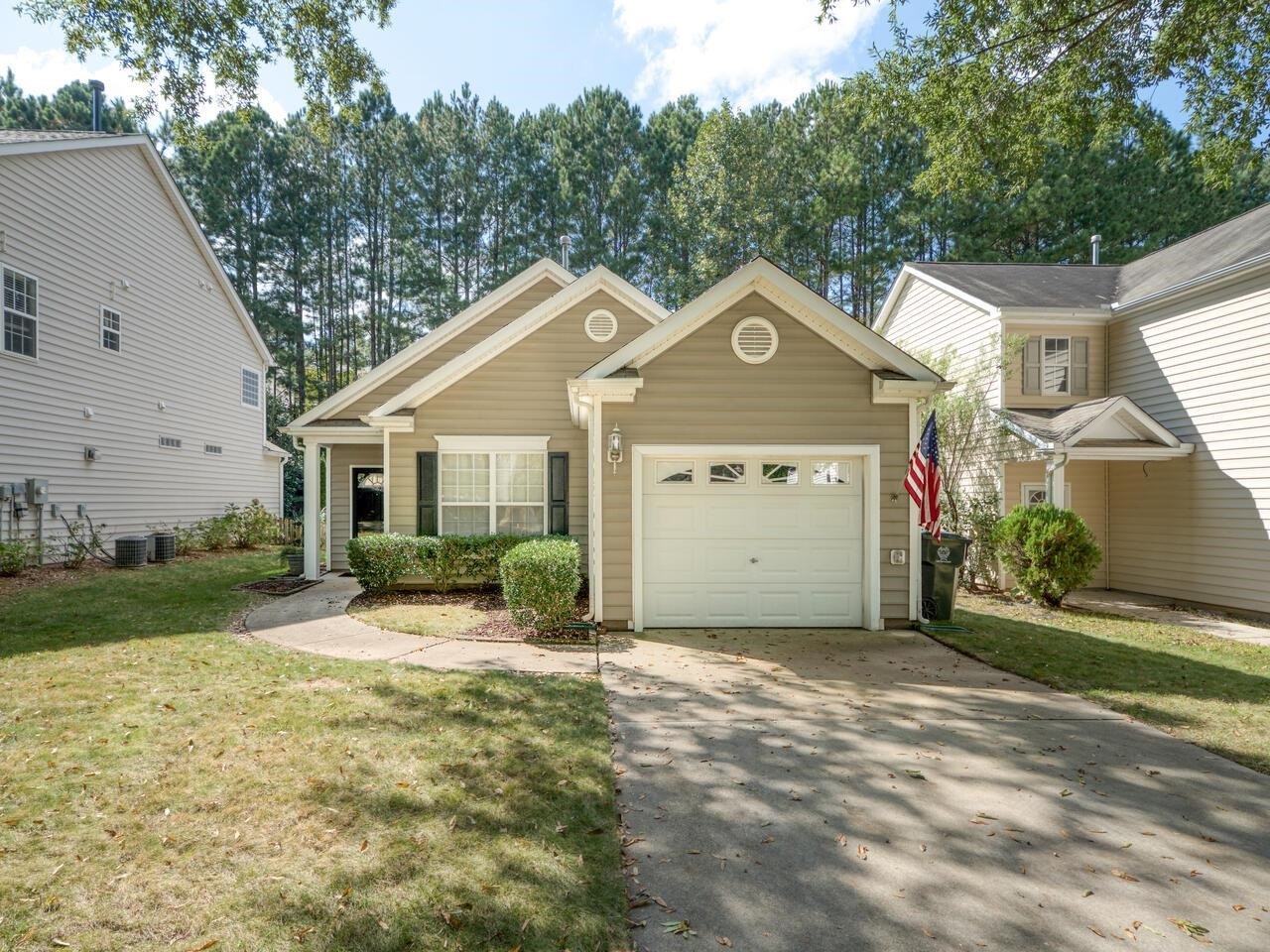 8425 Lunar Stone Place Raleigh, NC 27613 - Photo 1 of 34 a front view of a house with a yard and garage