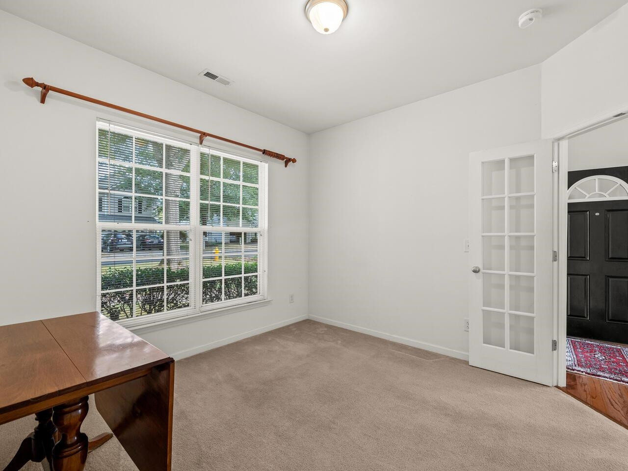 8425 Lunar Stone Place Raleigh, NC 27613 - Photo 14 of 34 an empty room with windows