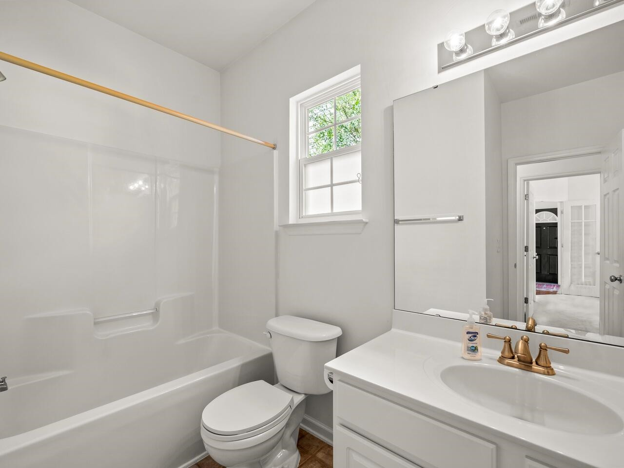 8425 Lunar Stone Place Raleigh, NC 27613 - Photo 18 of 34 a bathroom with a sink toilet and shower
