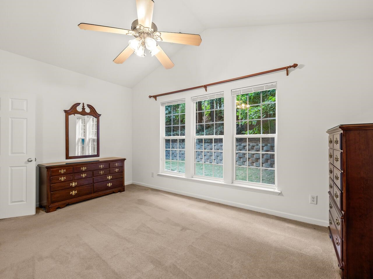 8425 Lunar Stone Place Raleigh, NC 27613 - Photo 21 of 34 an empty room with windows and cabinet