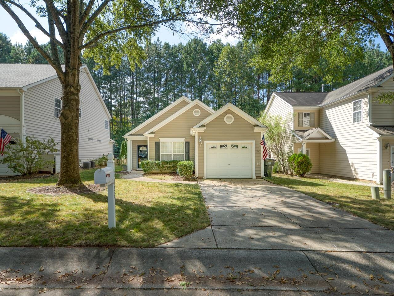 8425 Lunar Stone Place Raleigh, NC 27613 - Photo 27 of 34 a front view of a house with garden