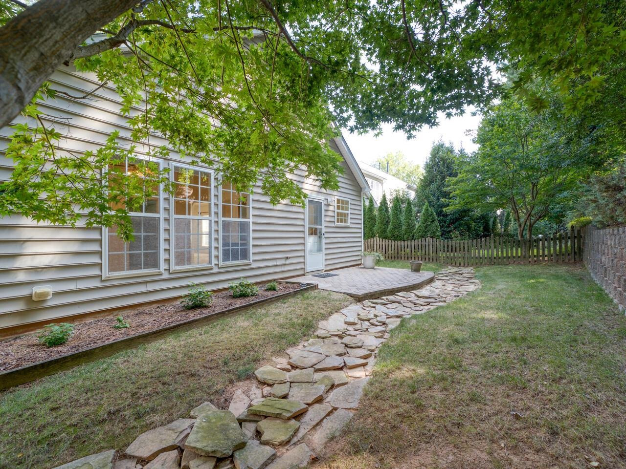 8425 Lunar Stone Place Raleigh, NC 27613 - Photo 33 of 34 a backyard of a house with lots of green space