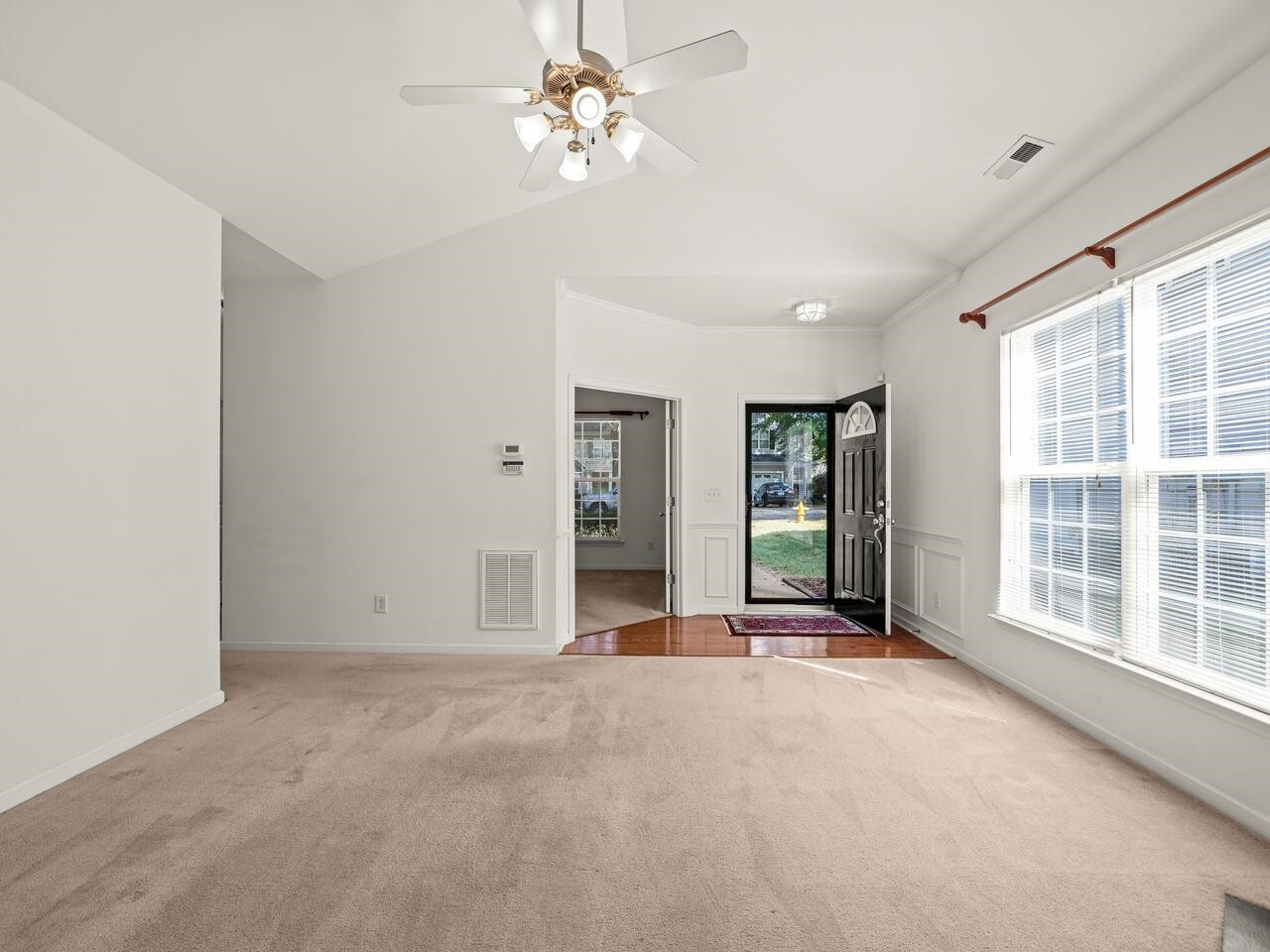 8425 Lunar Stone Place Raleigh, NC 27613 - Photo 4 of 34 a view of an empty room with a window