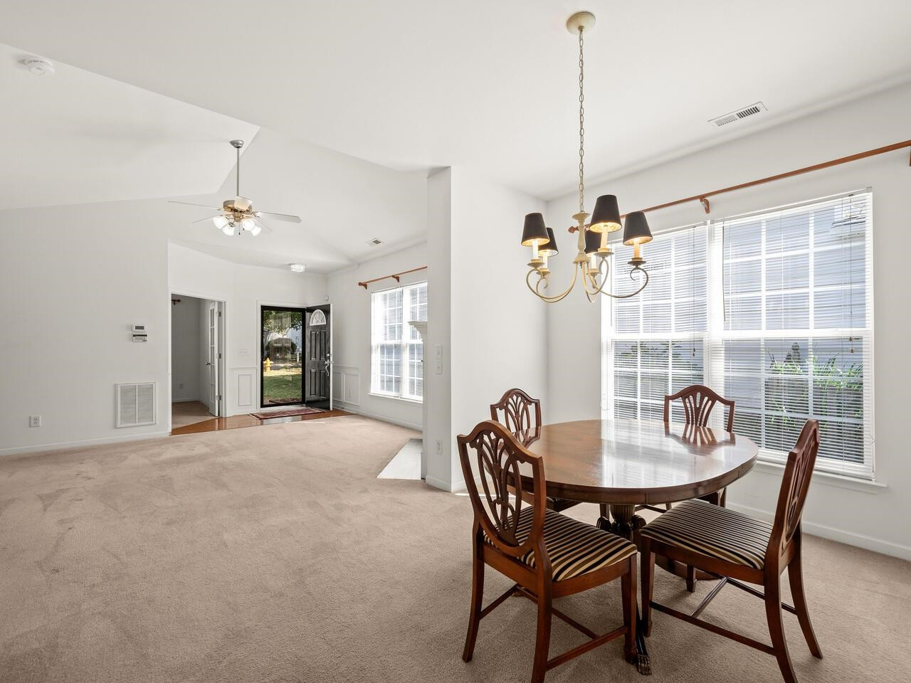 8425 Lunar Stone Place Raleigh, NC 27613 - Photo 5 of 34 a view of a dining room with furniture window and outside view