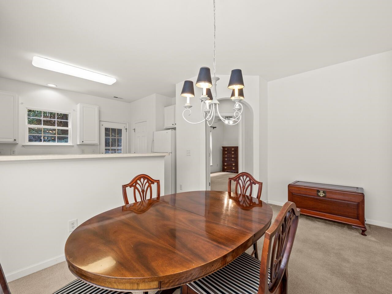 8425 Lunar Stone Place Raleigh, NC 27613 - Photo 7 of 34 a view of a dining room with furniture