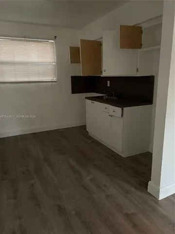 a view of kitchen with wooden floor