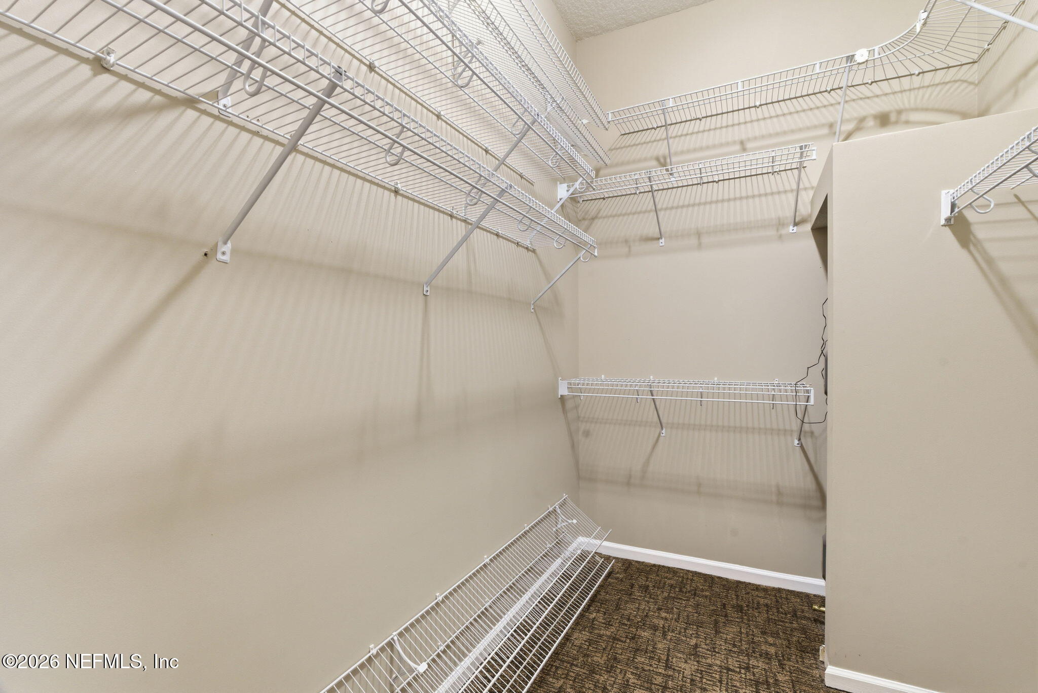 1600 Spring Water Court Fleming Island, FL 32003 - Photo 51 of 85 a view of a room with racks on the wall