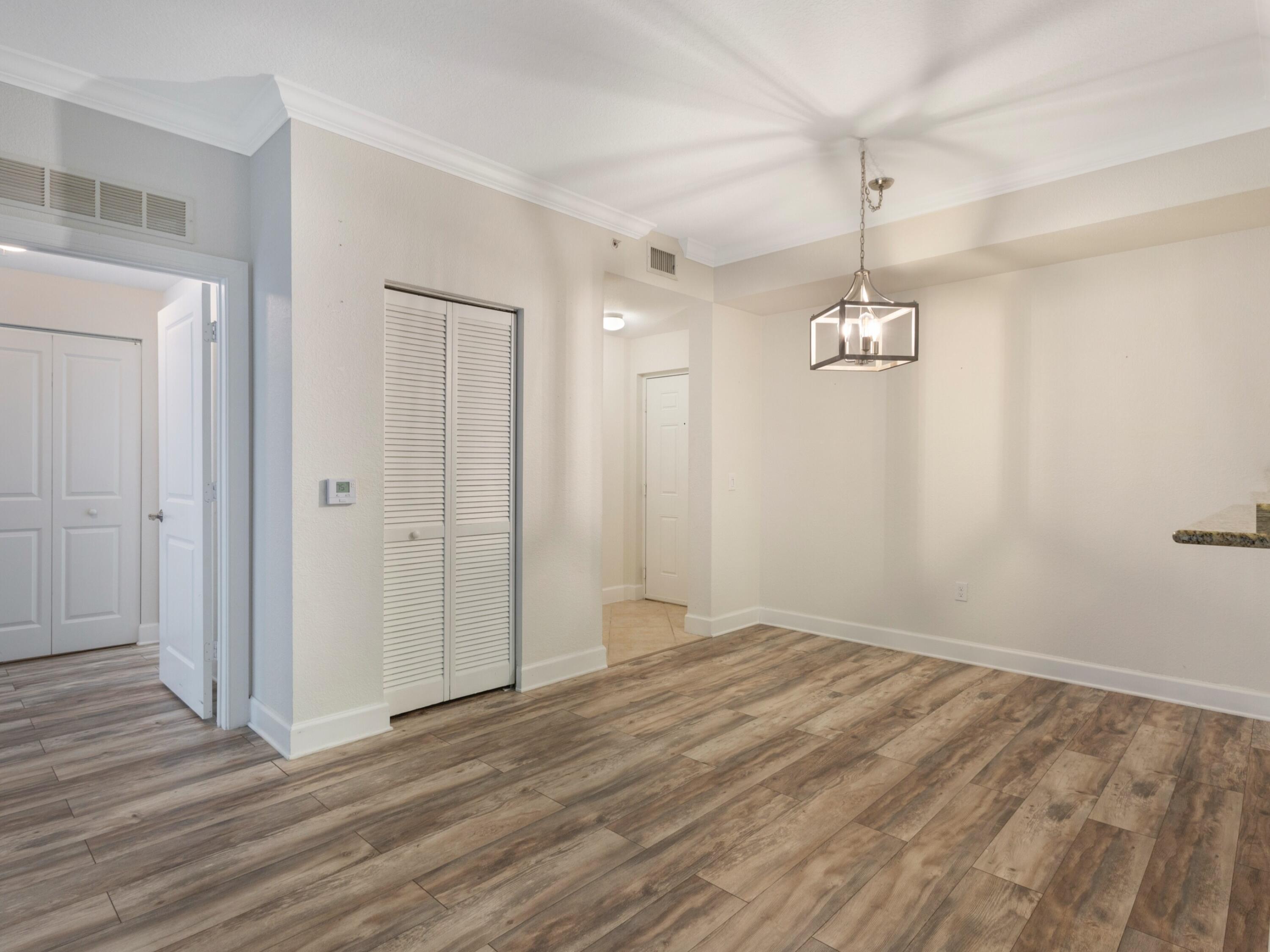 1660 Renaissance Commons Boulevard, Unit 2326 Boynton Beach, FL 33426 - Photo 19 of 59 wooden floor in an empty room with a window