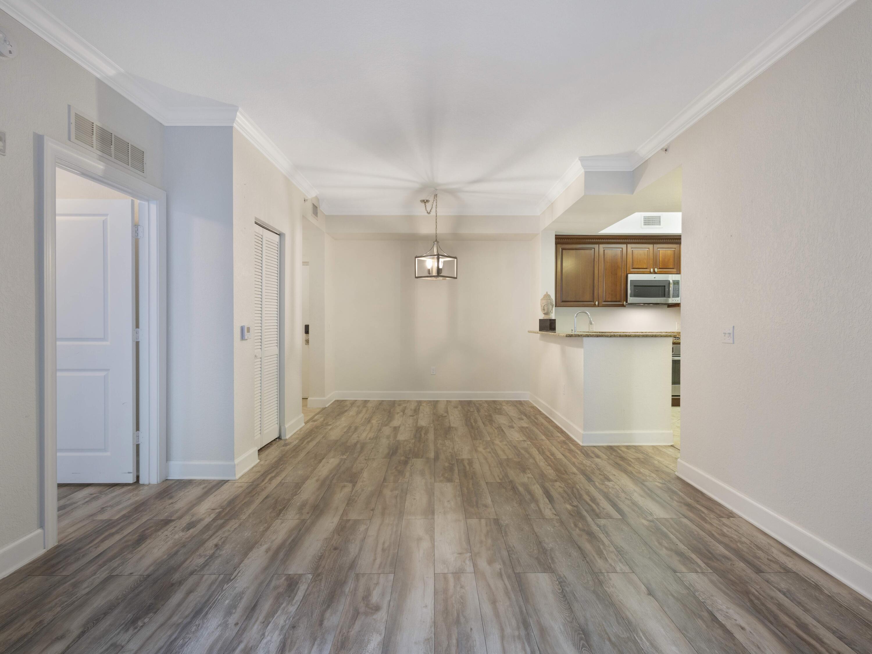 1660 Renaissance Commons Boulevard, Unit 2326 Boynton Beach, FL 33426 - Photo 20 of 59 a view of empty room with wooden floor