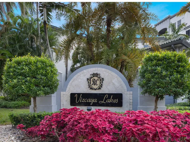 a building with palm trees in front of it