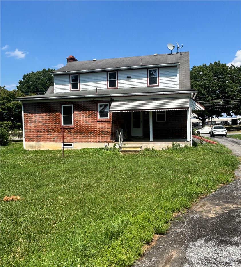 848 Hausman Road Allentown, PA 18104 - Photo 4 of 11 A classic brick and siding home offers a welcoming covered porch, ready for personalization.