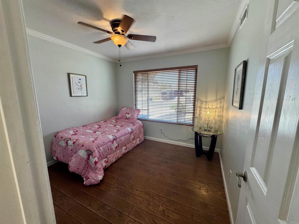 12443 Danes Road Poway, CA 92064 - Photo 16 of 44 a bedroom with a bed and a window