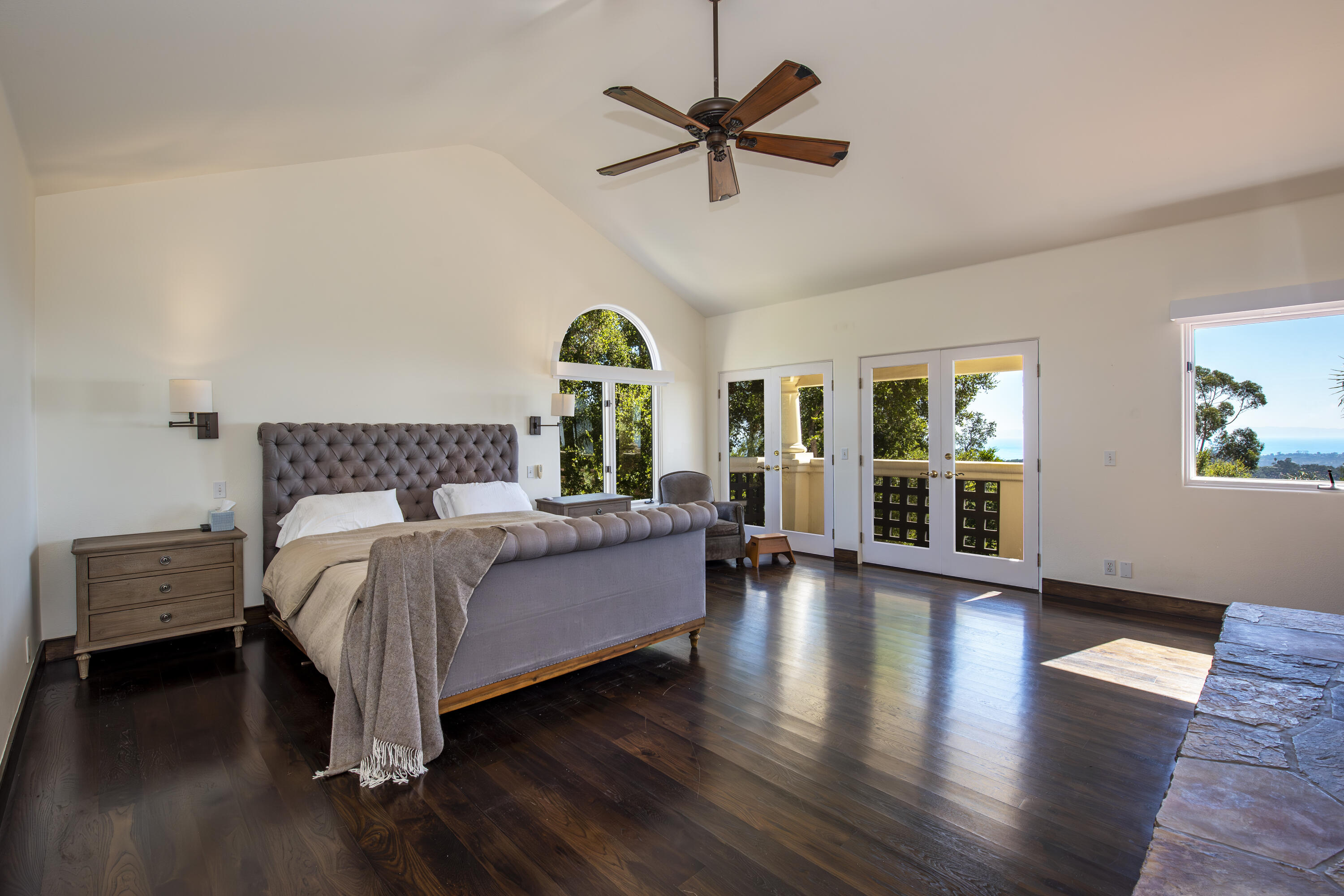 438 El Cielito Road Santa Barbara, CA 93105 - Photo 8 of 25 a spacious bedroom with a bed a chandelier and a large window