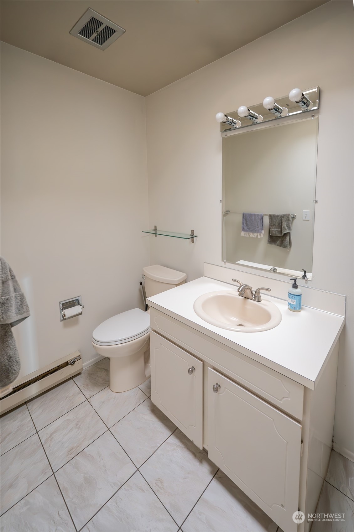15 Ward Street Seattle, WA 98109 - Photo 13 of 17 a bathroom with a sink toilet and mirror