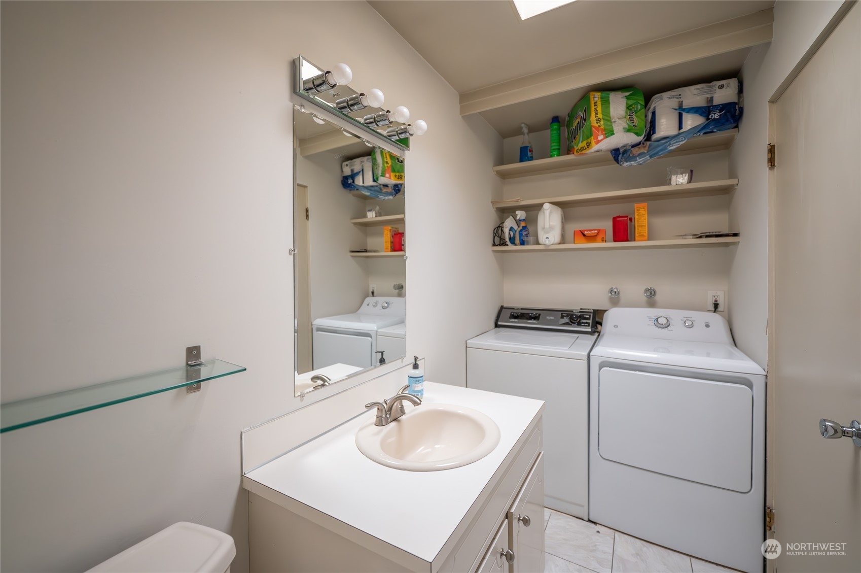 15 Ward Street Seattle, WA 98109 - Photo 14 of 17 a bathroom with a sink toilet and a mirror