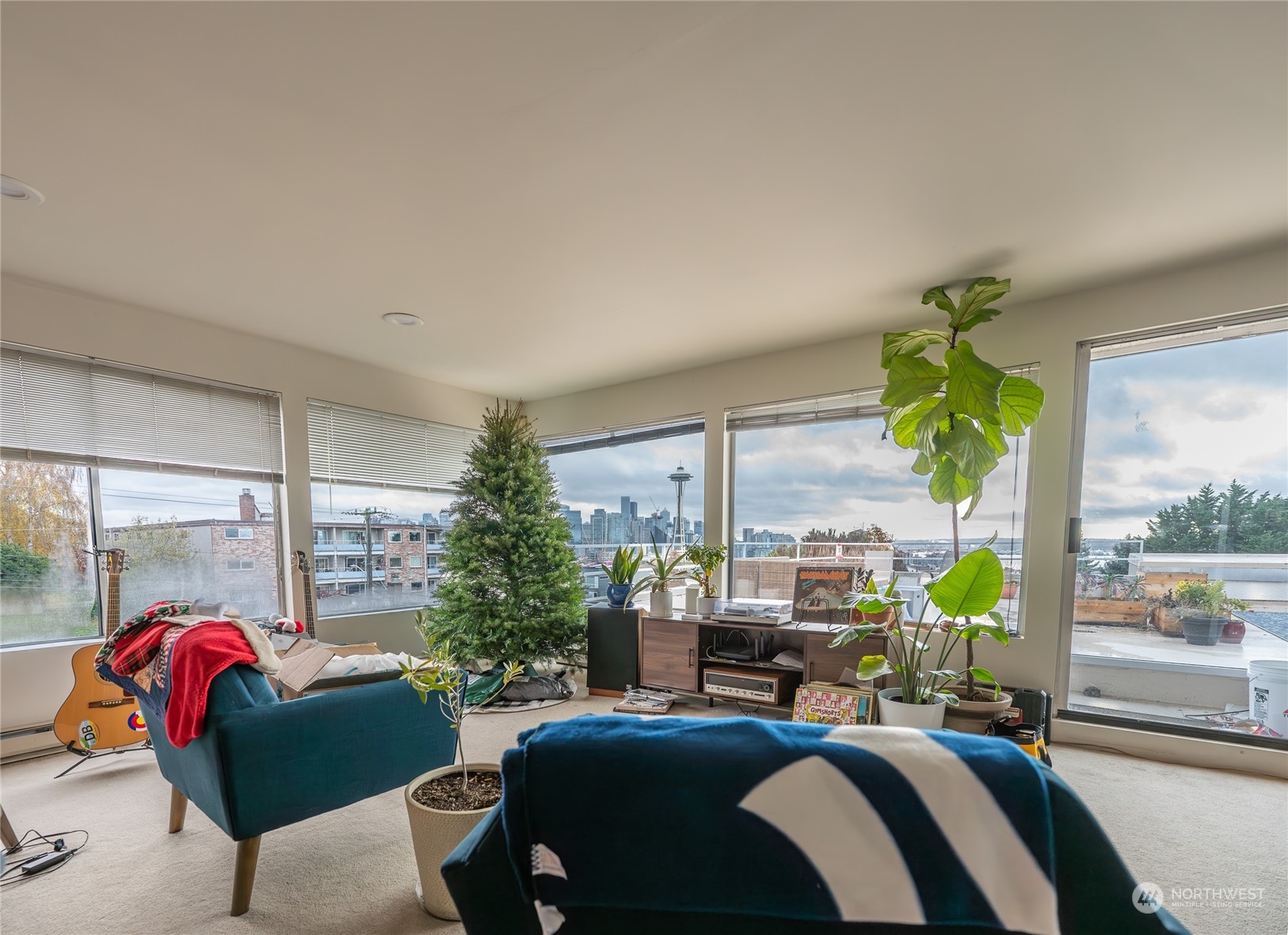 15 Ward Street Seattle, WA 98109 - Photo 9 of 17 a living room with furniture a chandelier and a window