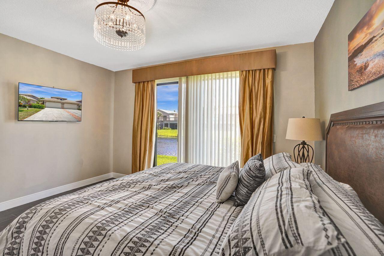 5465 Monterey Circle, Unit D Delray Beach, FL 33484 - Photo 39 of 67 Primary Bedroom Sliders