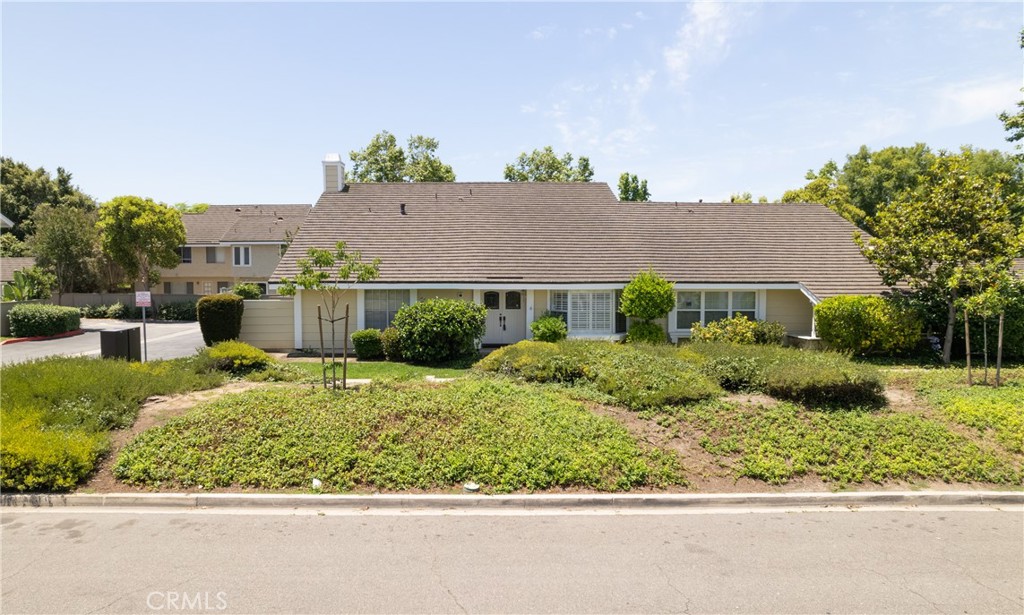 94 Wildwood, Unit 11 Irvine, CA 92604 - Photo 1 of 41 a front view of a house with a yard