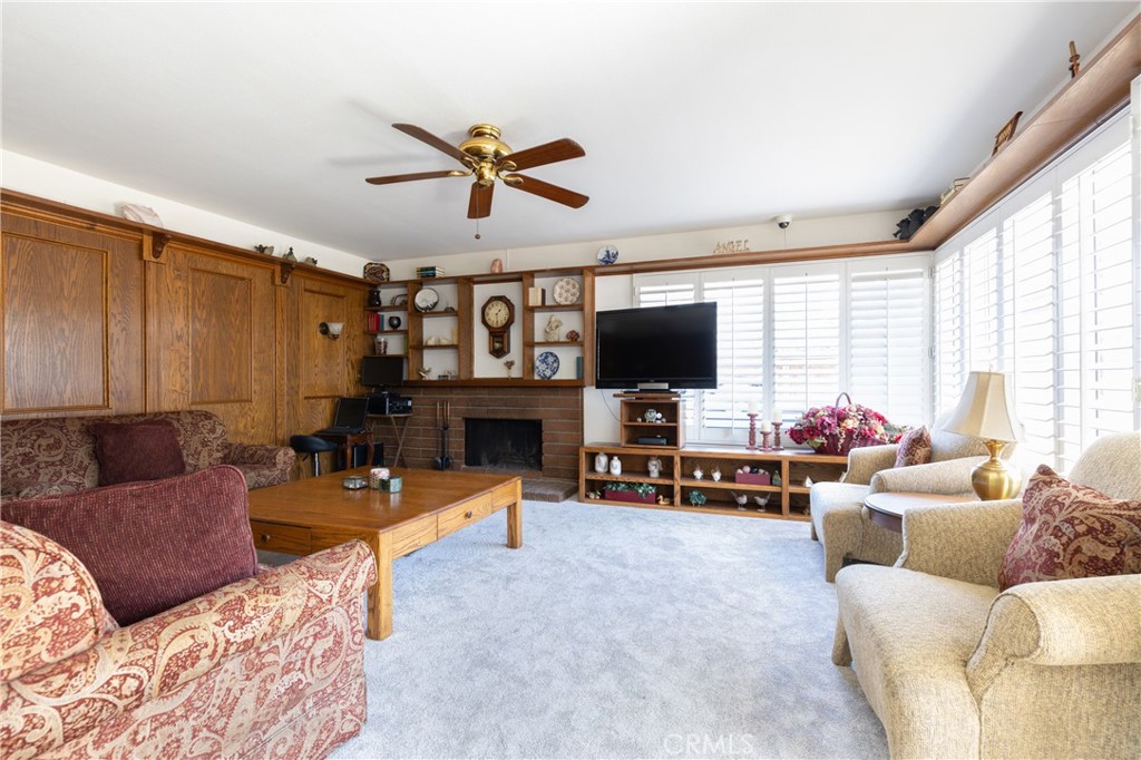 94 Wildwood, Unit 11 Irvine, CA 92604 - Photo 14 of 41 a living room with furniture and a flat screen tv