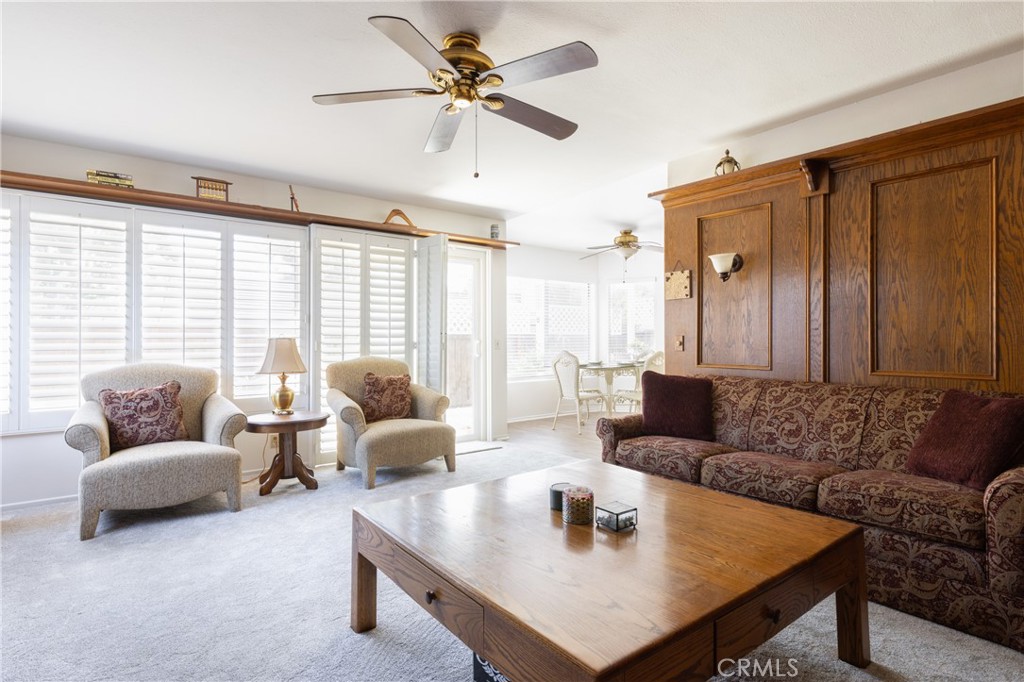 94 Wildwood, Unit 11 Irvine, CA 92604 - Photo 17 of 41 a living room with furniture and a large window