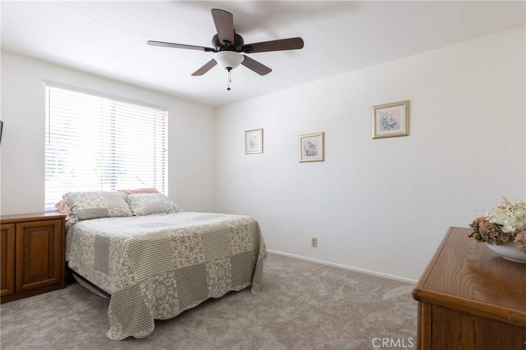 94 Wildwood, Unit 11 Irvine, CA 92604 - Photo 20 of 41 a bedroom with a bed and a window