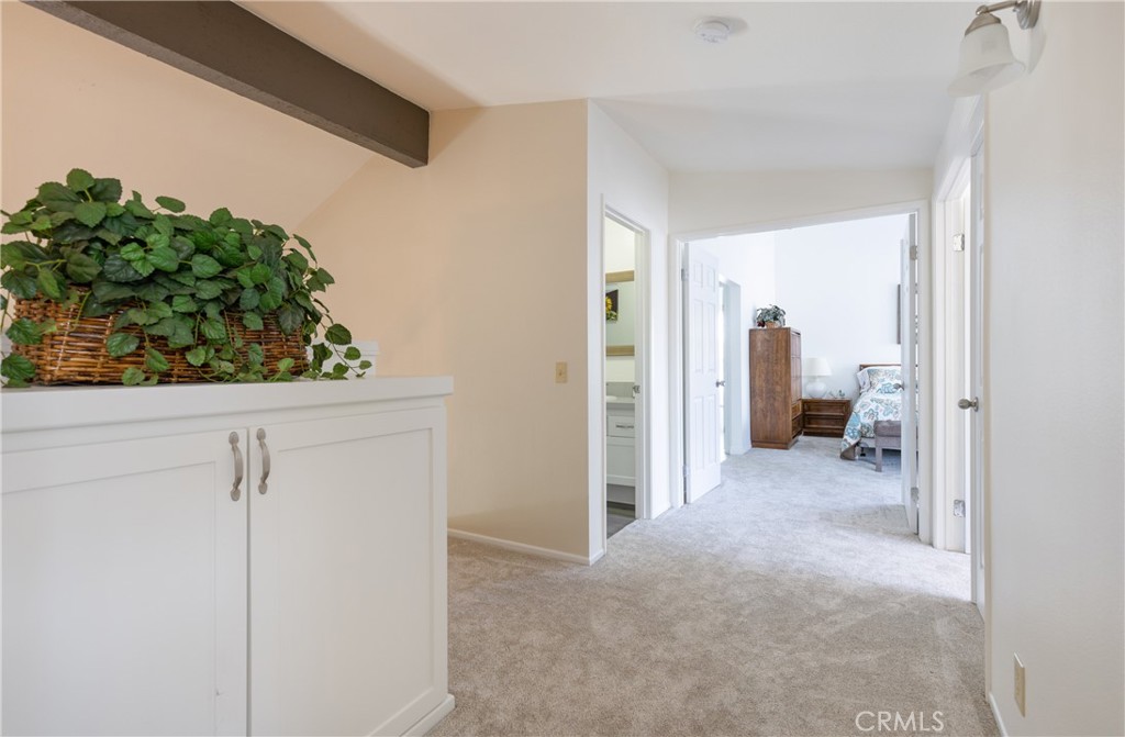 94 Wildwood, Unit 11 Irvine, CA 92604 - Photo 21 of 41 a view of a hallway with wooden shelves